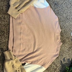 This is a really cute sweater. It was worn a couple of times and has a stain.